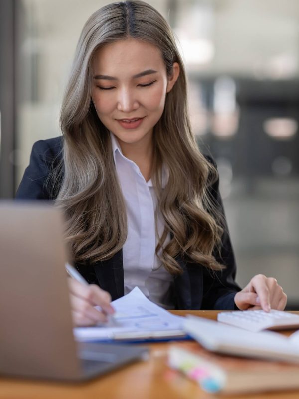 business-asian-woman-or-accountant-bookkeeper-working-on-calculator-to-calculate-business-data-1-1.jpg