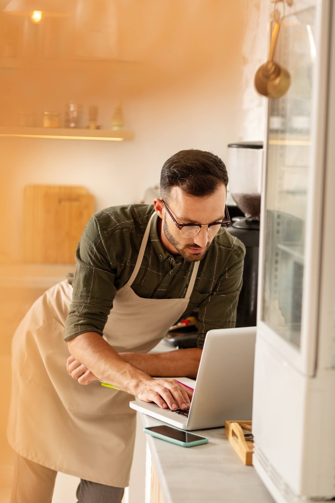 businessman-doing-bookkeeping-while-owning-coffee-shop.jpg